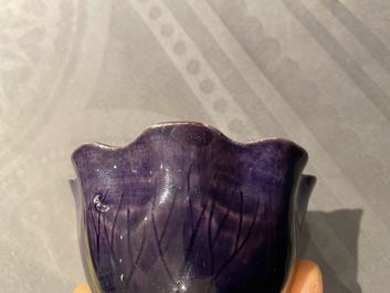 A Chinese aubergine- and turquoise-glazed 'lotus' trick cup, Kangxi