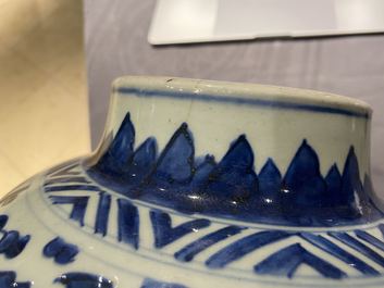 A pair of Chinese blue and white 'lotus scroll' vases and covers, Kangxi