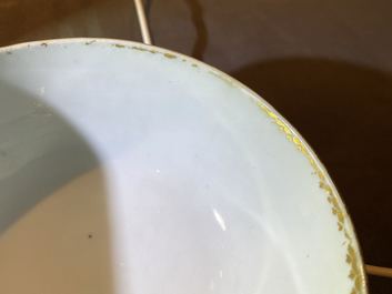 Four Chinese gilt-decorated blue-ground cups and saucers with fine landscapes, Qianlong