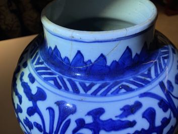 A pair of Chinese blue and white 'lotus scroll' vases and covers, Kangxi