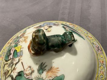 A pair of Chinese famille verte vases and covers with warrior scenes, 19th C.