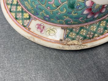 A pair of Chinese famille rose vases and covers, 19th C.