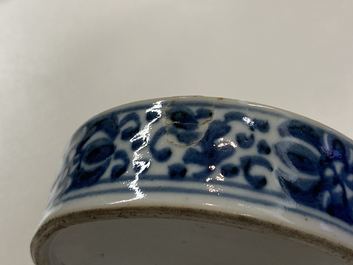 A pair of Chinese blue and white four-tier stacking boxes, a seal paste box and four saucers, 19th C.