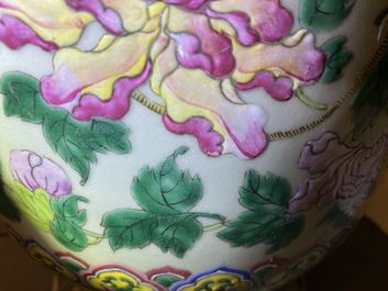 A pair of Chinese famille rose celadon-ground 'dragon' vases, 19th C.