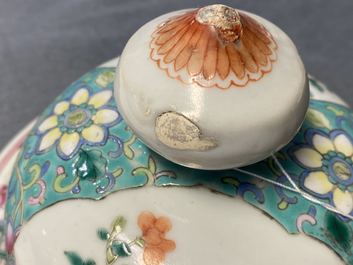 A pair of Chinese famille rose vases and covers, 19th C.