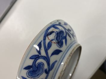A pair of Chinese blue and white four-tier stacking boxes, a seal paste box and four saucers, 19th C.