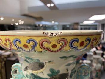 A pair of Chinese famille rose celadon-ground 'dragon' vases, 19th C.