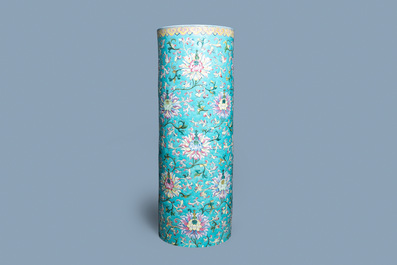 A large Chinese famille rose cylindrical vase with molded lotus scrolls, Jiaqing/Daoguang
