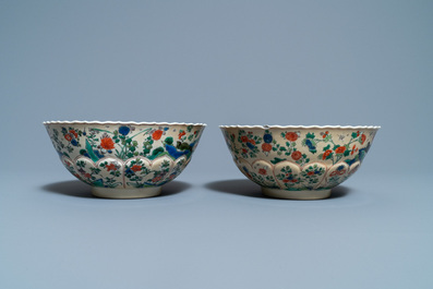 A pair of Chinese famille verte caf&eacute;-au-lait-ground lotus-molded bowls, Kangxi