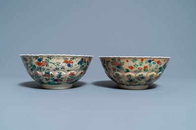 A pair of Chinese famille verte caf&eacute;-au-lait-ground lotus-molded bowls, Kangxi