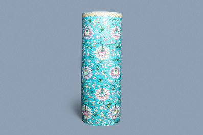 A large Chinese famille rose cylindrical vase with molded lotus scrolls, Jiaqing/Daoguang