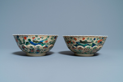 A pair of Chinese famille verte caf&eacute;-au-lait-ground lotus-molded bowls, Kangxi