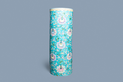 A large Chinese famille rose cylindrical vase with molded lotus scrolls, Jiaqing/Daoguang