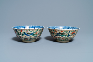 A pair of Chinese famille verte caf&eacute;-au-lait-ground lotus-molded bowls, Kangxi
