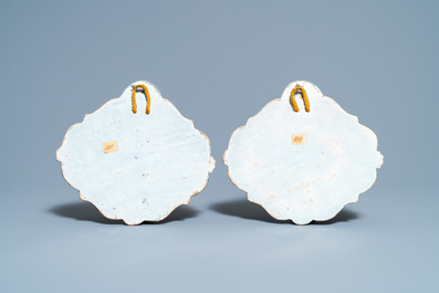 A pair of polychrome Dutch Delft 'flower basket' plaques, 18th C.