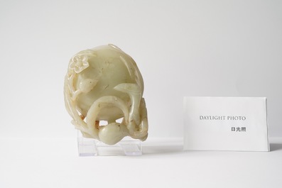 A Chinese mottled celadon and brown jade peach-form brush washer, Qing