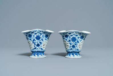 A pair of rare Chinese blue and white double-walled reticulated trilobed libation cups, Qianlong