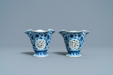 A pair of rare Chinese blue and white double-walled reticulated trilobed libation cups, Qianlong