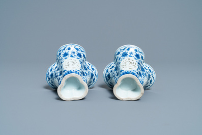 A pair of rare Chinese blue and white double-walled reticulated trilobed libation cups, Qianlong