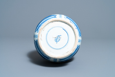 A Chinese blue and white bottle vase with flower arrangements, Kangxi