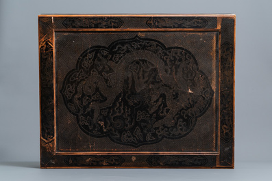 A Chinese black- and red-lacquered wooden 'dragon' table, 19th C.