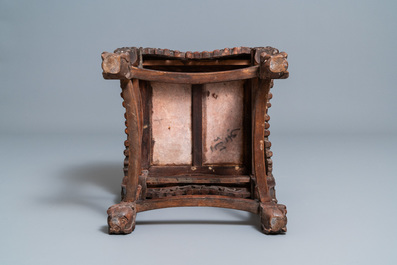 A Chinese carved wooden stand with marble top, 19th C.