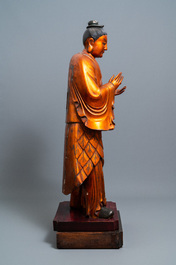 A massive Chinese gilded wooden figure of a standing male, 18/19th C.