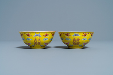 A pair of Chinese famille rose yellow-ground 'butterfly' bowls, Tongzhi mark, 20th C.