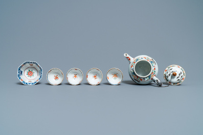 A Chinese famille verte teapot, seven saucers and five cups, Kangxi