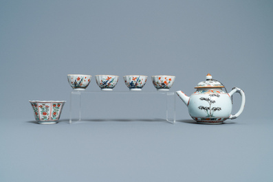 A Chinese famille verte teapot, seven saucers and five cups, Kangxi
