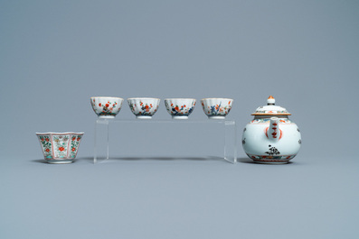 A Chinese famille verte teapot, seven saucers and five cups, Kangxi