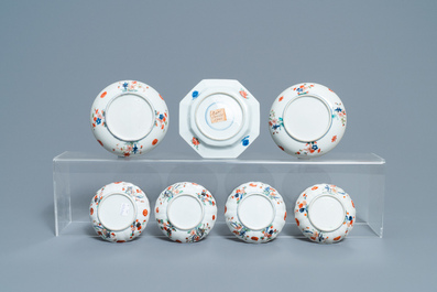 A Chinese famille verte teapot, seven saucers and five cups, Kangxi