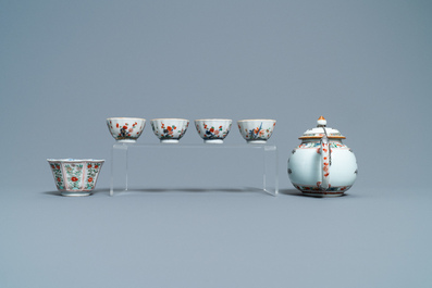 A Chinese famille verte teapot, seven saucers and five cups, Kangxi