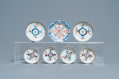 A Chinese famille verte teapot, seven saucers and five cups, Kangxi