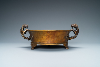 A large Chinese bronze tripod censer with chilong handles, Xuande mark, 18/19th C.