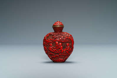 A Chinese carved red cinnabar lacquer 'boys at play' snuff bottle, imperial workshops, Qianlong/Jiaqing