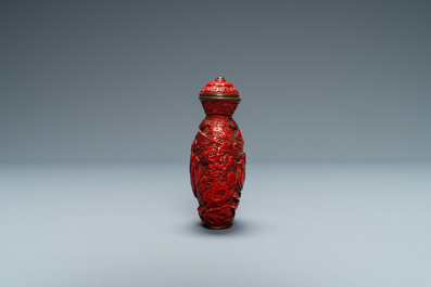 A Chinese carved red cinnabar lacquer 'boys at play' snuff bottle, imperial workshops, Qianlong/Jiaqing