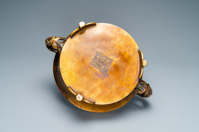 A large Chinese bronze tripod censer with chilong handles, Xuande mark, 18/19th C.