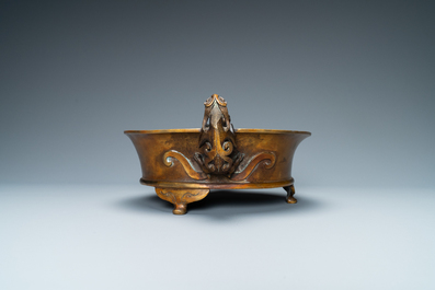 A large Chinese bronze tripod censer with chilong handles, Xuande mark, 18/19th C.