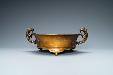 A large Chinese bronze tripod censer with chilong handles, Xuande mark, 18/19th C.