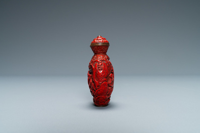 A Chinese carved red cinnabar lacquer 'boys at play' snuff bottle, imperial workshops, Qianlong/Jiaqing