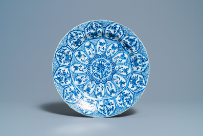 A Chinese blue and white 'lotus' dish and a famille verte dish, Kangxi