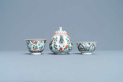 A Chinese famille verte teapot, two cups and three saucers, Kangxi