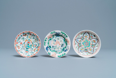 A Chinese famille verte teapot, two cups and three saucers, Kangxi