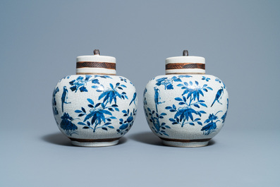 A pair of Chinese blue and white Nanking crackle-glazed jars and covers, 19th C.