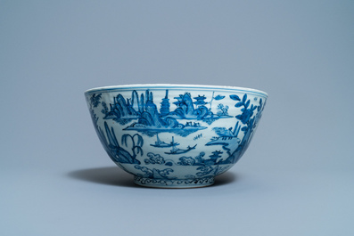 A large Chinese blue and white 'river landscape' bowl, Ming