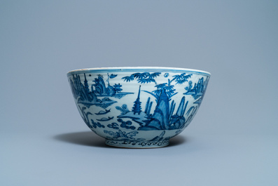 A large Chinese blue and white 'river landscape' bowl, Ming