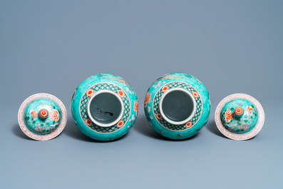 A pair of Chinese turquoise-ground famille verte vases and covers, 19th C.