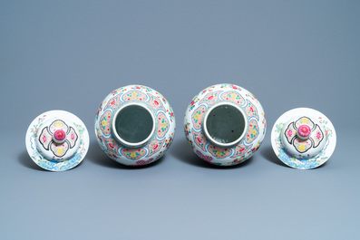 A pair of Chinese famille rose 'pheasants' vases and covers, 19th C.