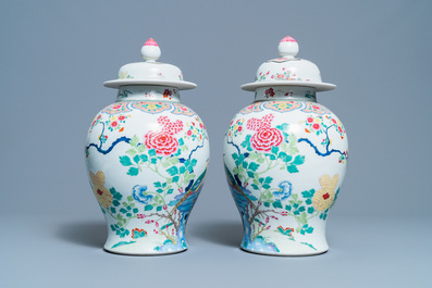 A pair of Chinese famille rose 'pheasants' vases and covers, 19th C.